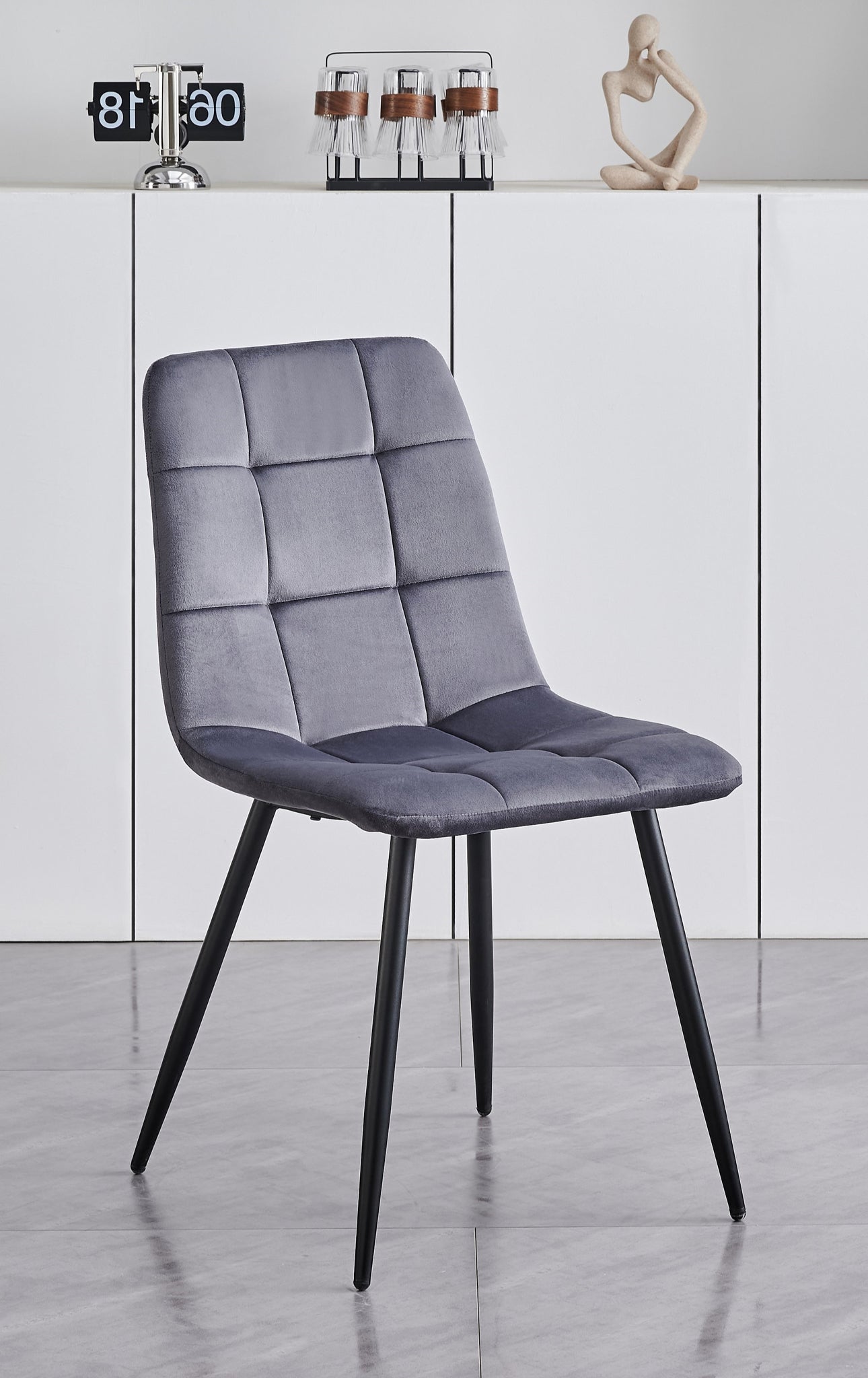 5 Piece White Marble Veneer Top With Black Pedestal Steel Base
Chairs: Soft Grey Velvet with Cross Stitching Details Black Steel Legs
Dimensions
Table: 48"Round 30"H
Chairs: 22"L 18"W 34"H